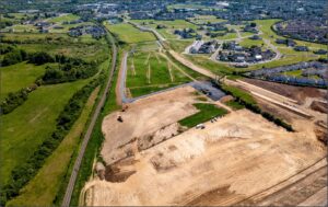 Aerial view of topsoil stripping. Showing site boundaries and clear subsoil that show the lack of discoloration associated with archaeological features.
